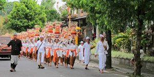 Balinese walking to a ceremony. . . welcome to Bali! Be prepared to stop and wait for 5-10 minutes, even in the middle of a main road.