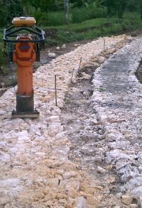 The road and a lonely stamper for the limestone.
